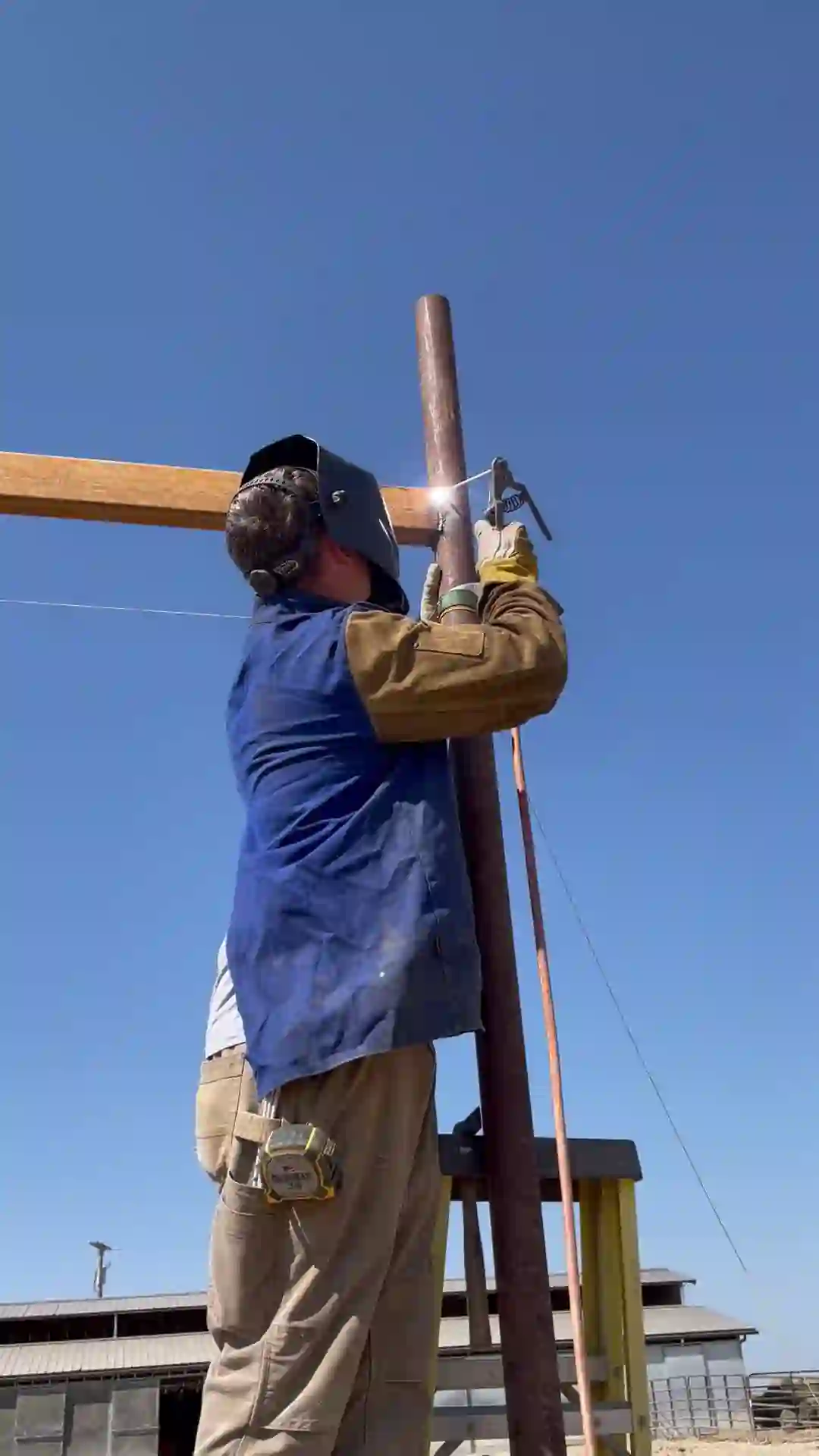 Duke welding a steel ranch structure