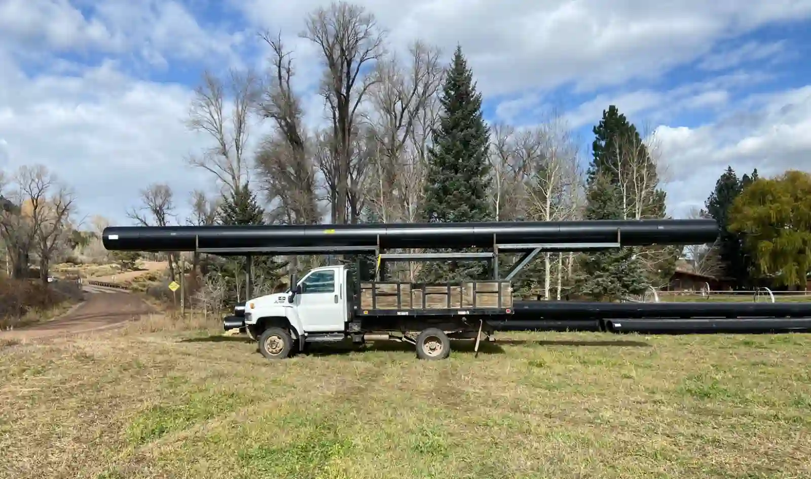 Pipe carried above the truck cab